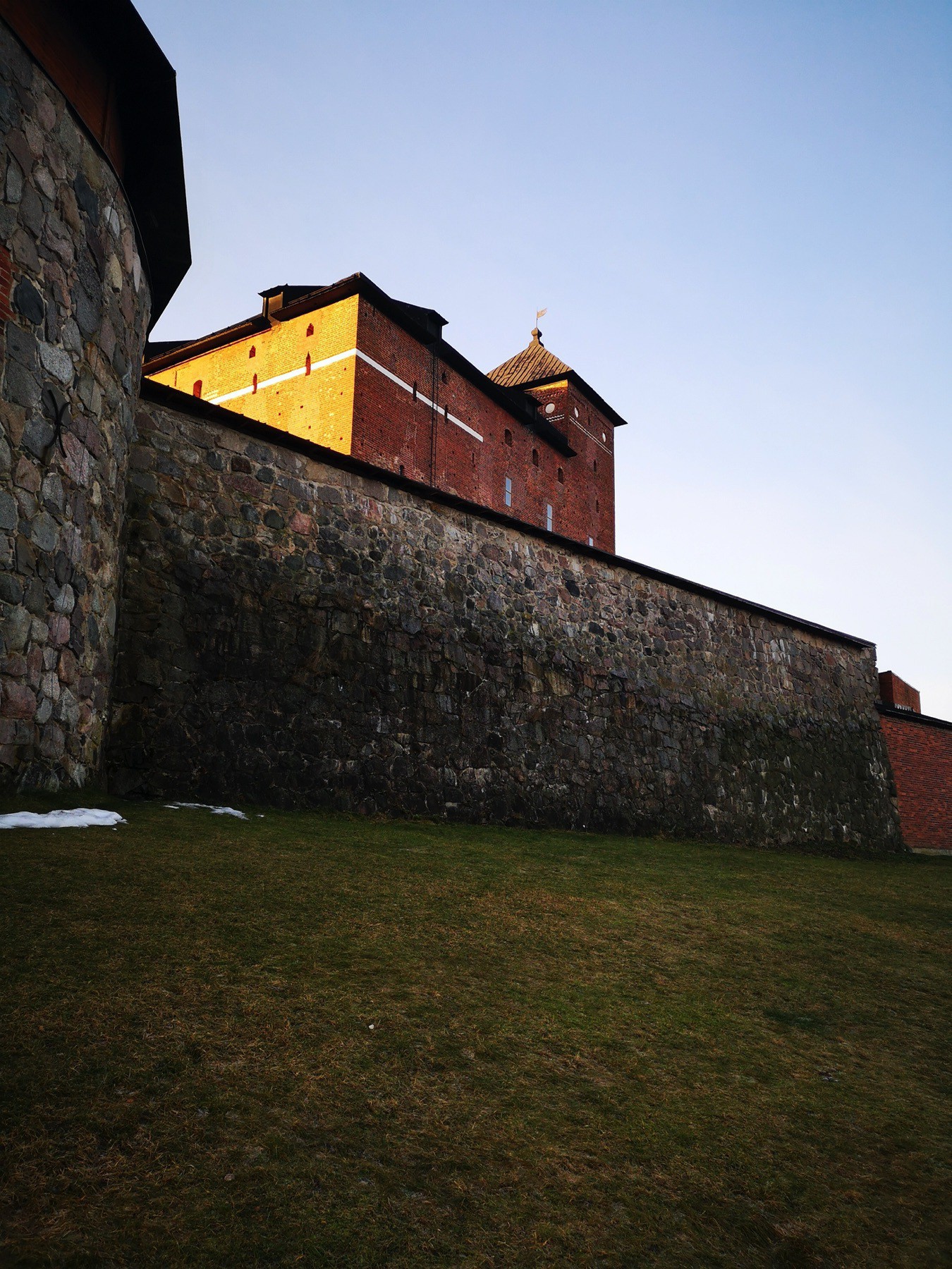 Häme castle lighted with rays of January sun