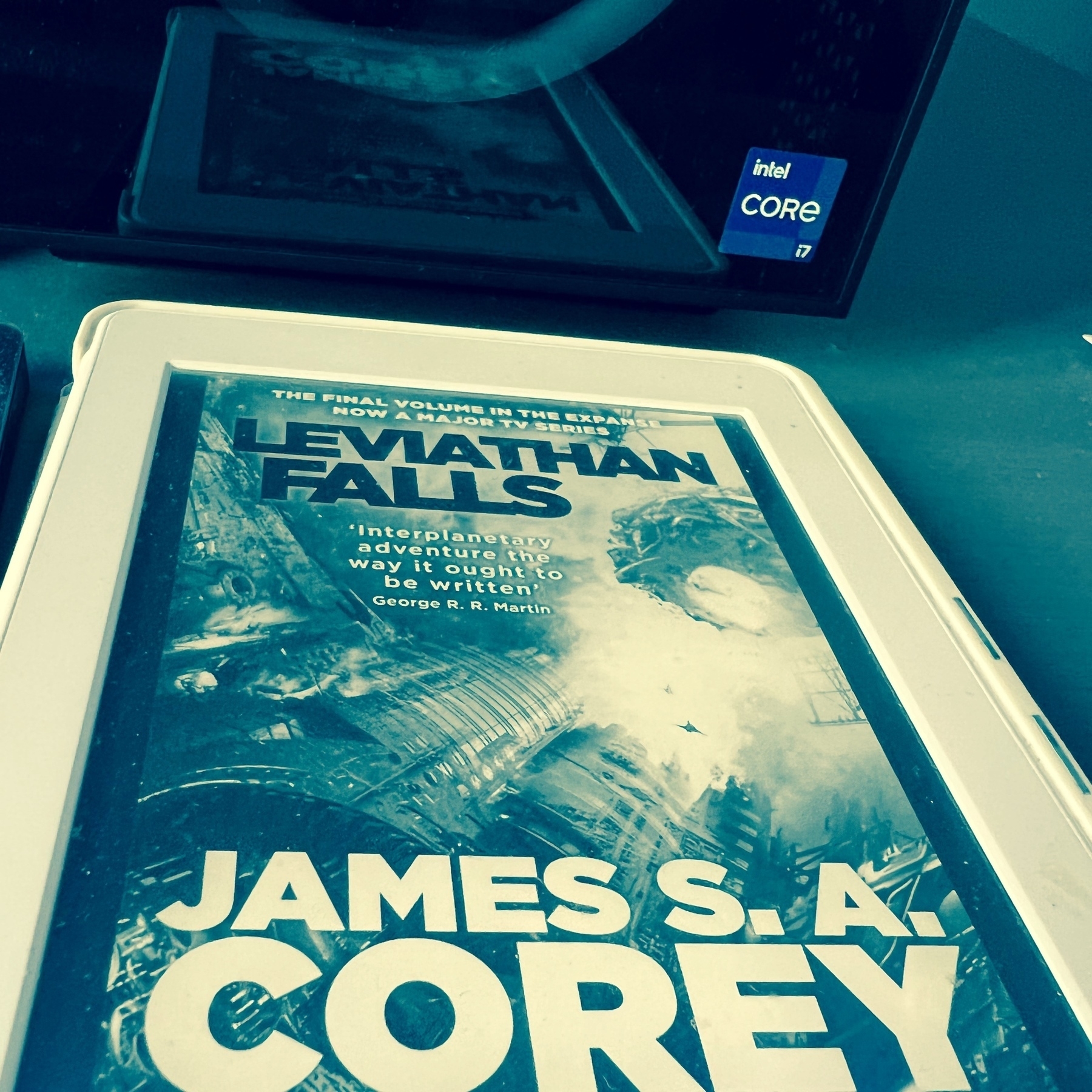 cover of Leviathan Falls shown on Kindle screen. computer on the background