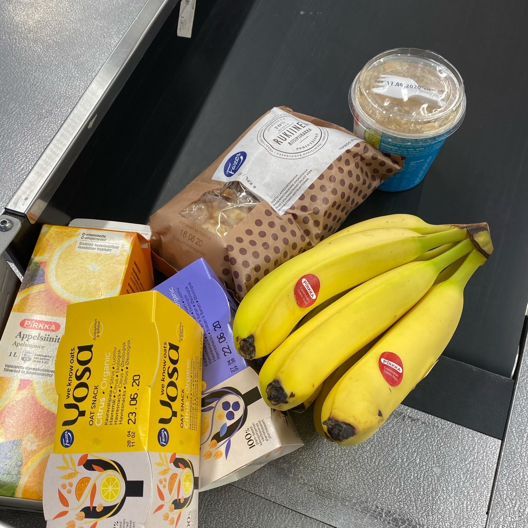 banana, yoghurt, orange juice on a store desk