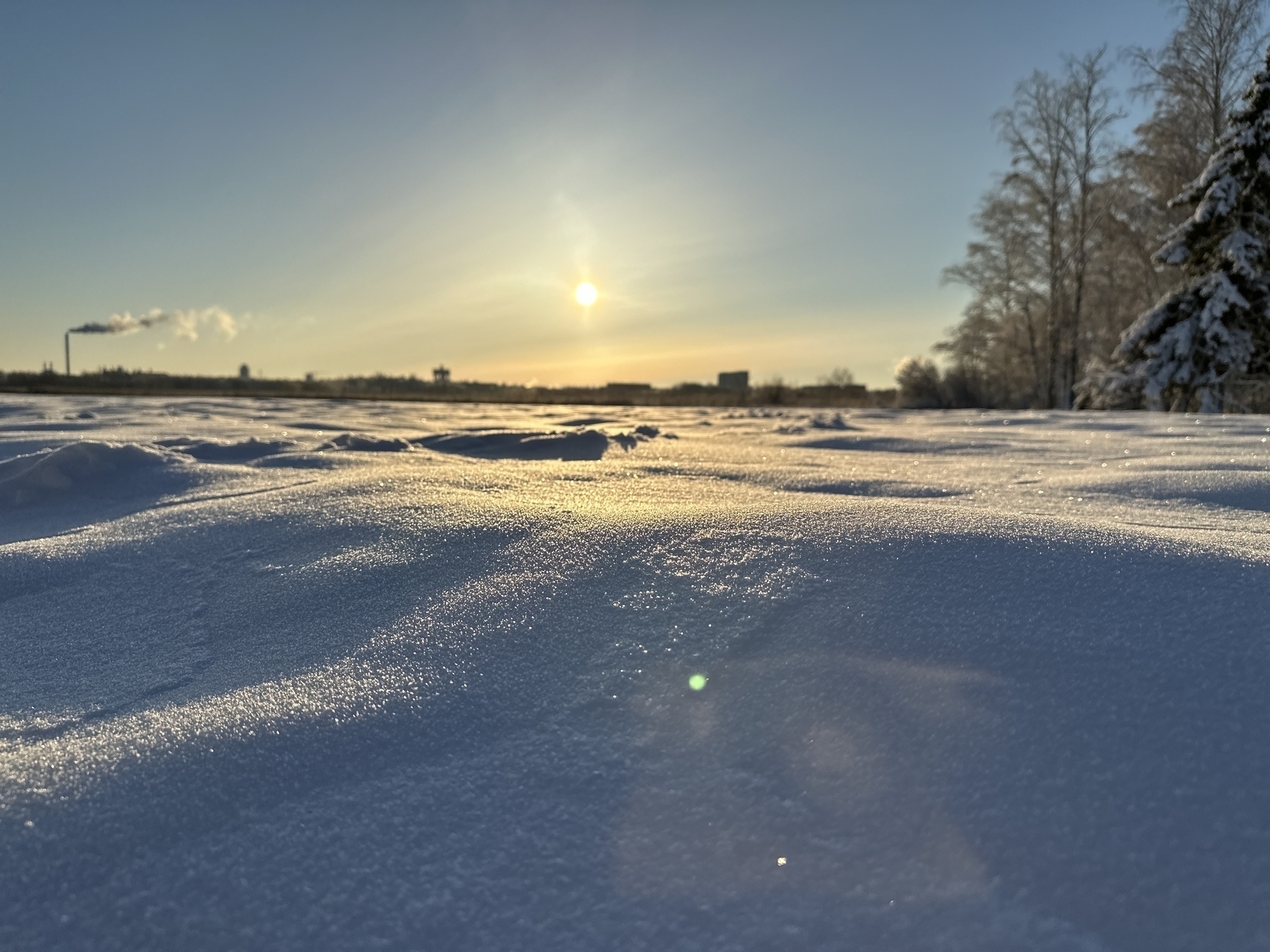Photo taken from just above the snow. Crispy, freezing snow, sun